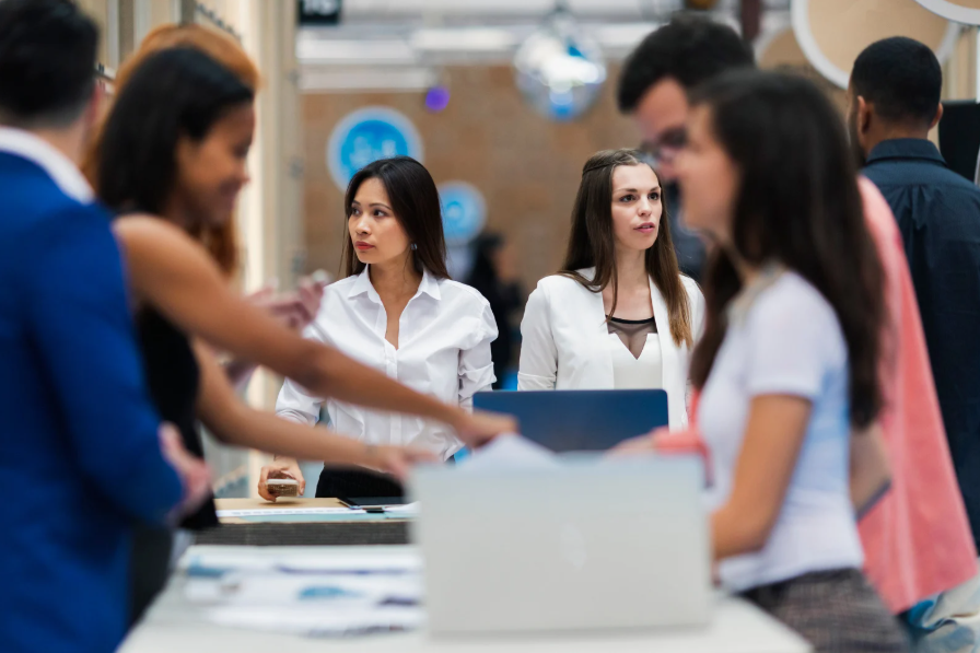 Two women presenting at exhibition